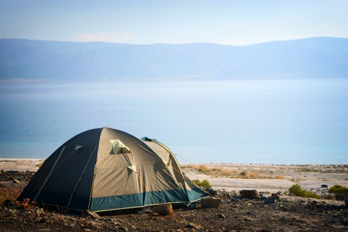 Guide to how to plan your first car camping trip with a tent by a mountain lake