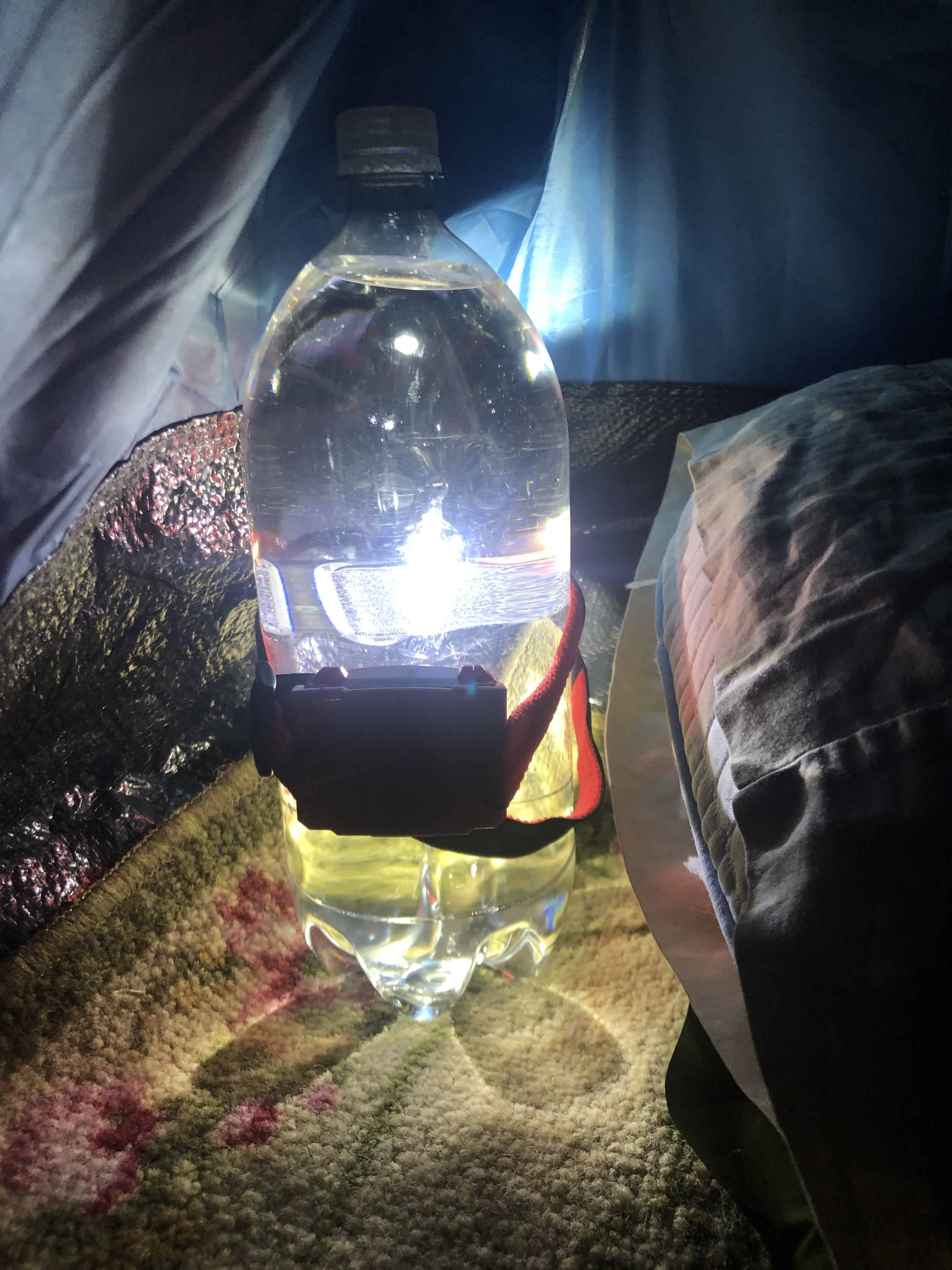Use a headlamp to provide a soft glow in your tent