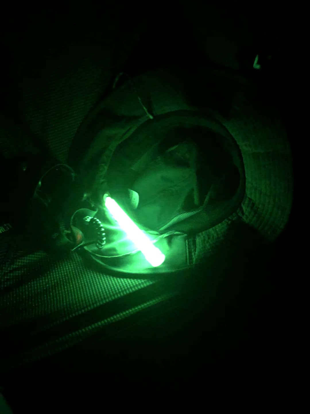 This is an example of a lightstick in my tent to act as a nightlight. I keep it in my chair that I place next to my cot. This soft green glow would be romantic if you are camping with a partner. Or you can get other colors. Also useful for helping nervous campers who don't want to sleep in pitch black. 