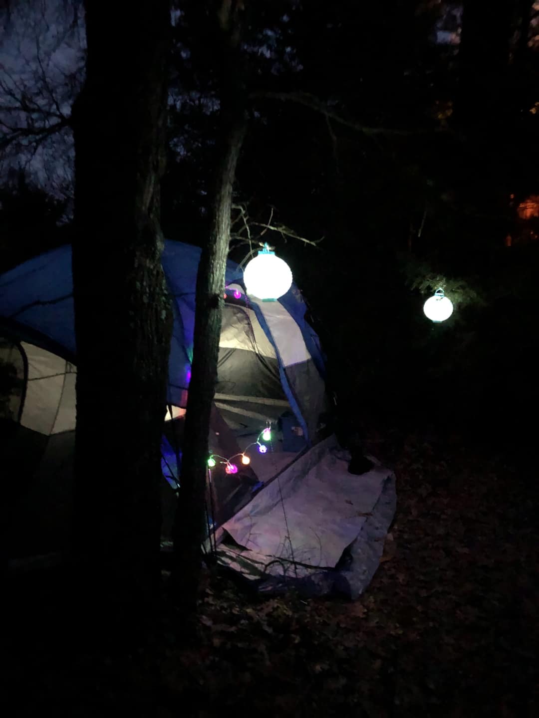 An example of a cozy tent. This is a tall pop-up tent complete with LED Christmas Lights, decorative Japanese glow ball lamps and even a queen size air matress on a frame. Then tent has rugs for extra comfort and cleanliness.