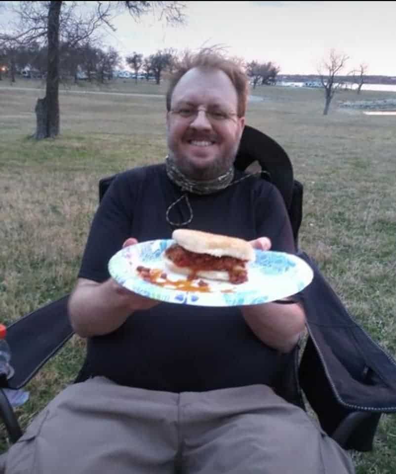 Photo of Mark Wilcox sitting in his camping chair