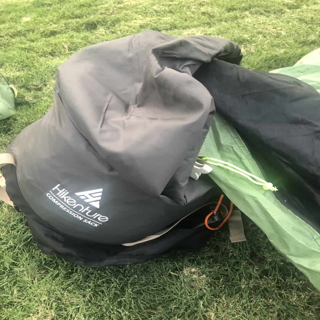 Showing how to put your tent back into a stuff sack after a camping trip.