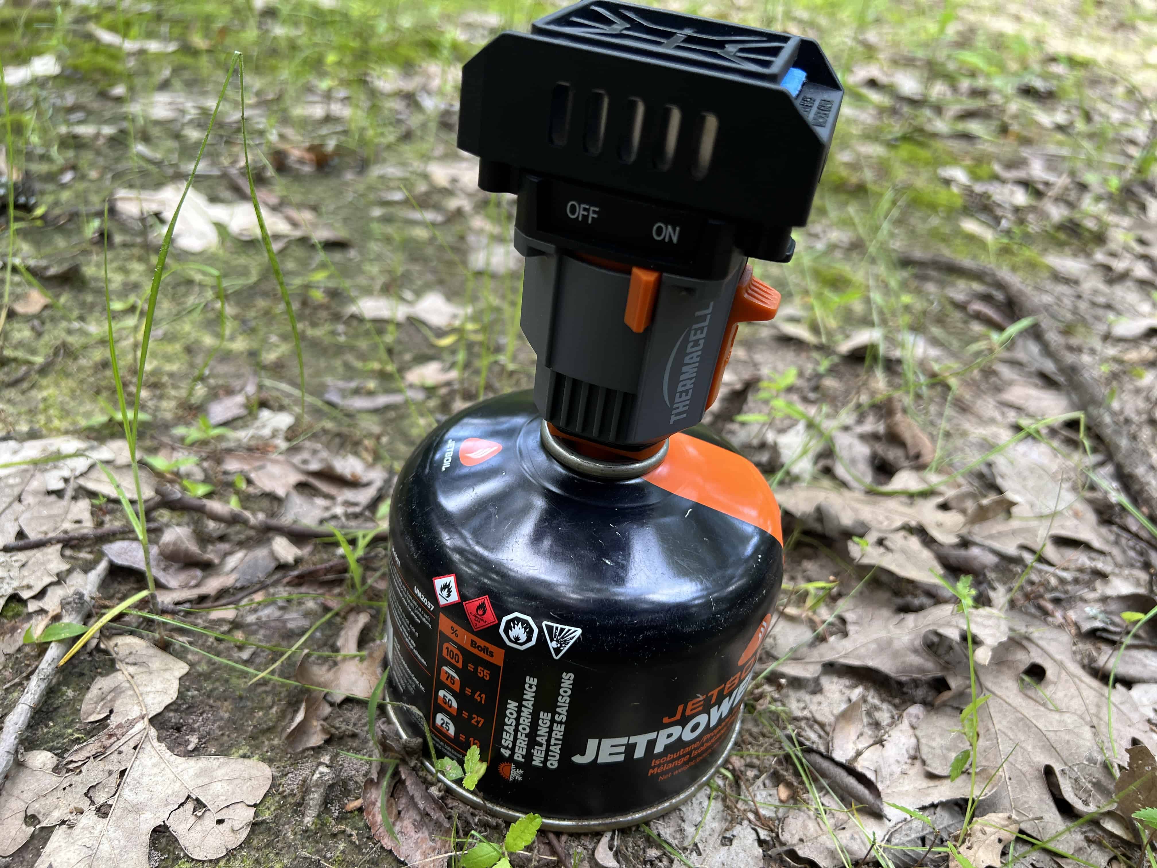 Photograph of a backpacking Thermacell connected to a isobutane can