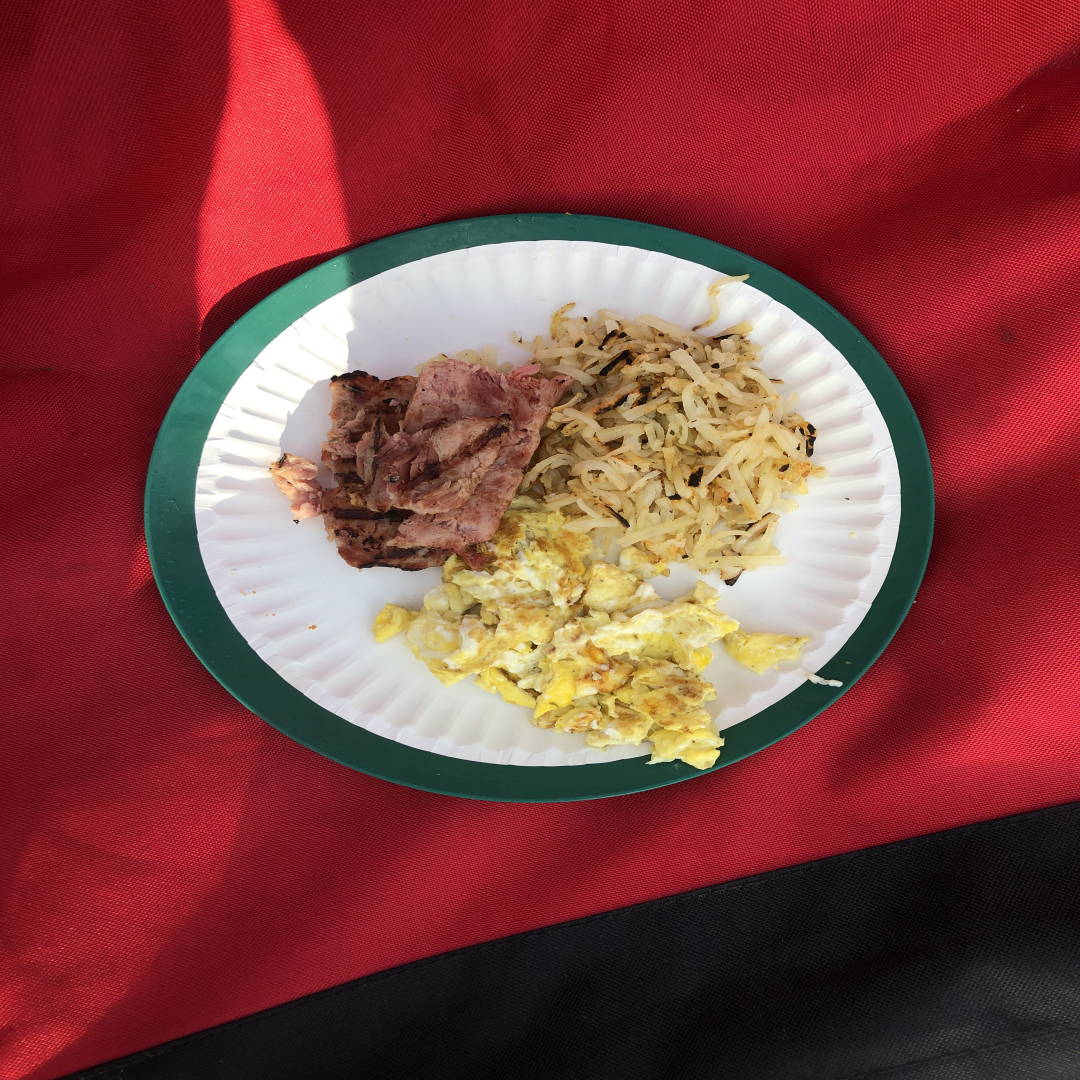 Photograph of my camping breakfast of scrambled eggs and ham.